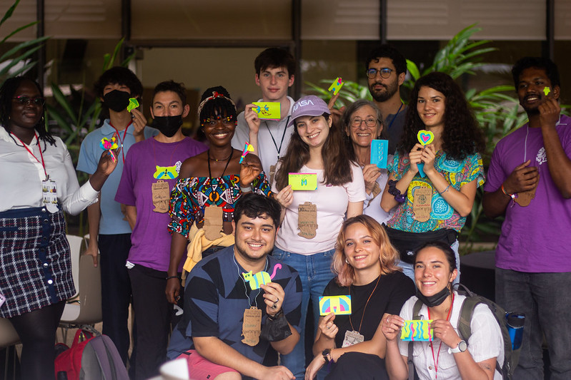 Photo of attendees at GOSH 2022 holding up PCB designs they made during a session.